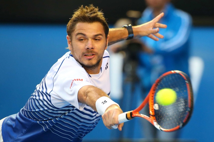 Tense struggle ... Stan Wawrinka plays a backhand against Novak Djokovic