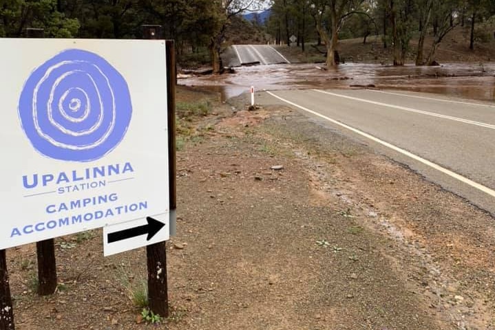 Water over a road crossing a creek