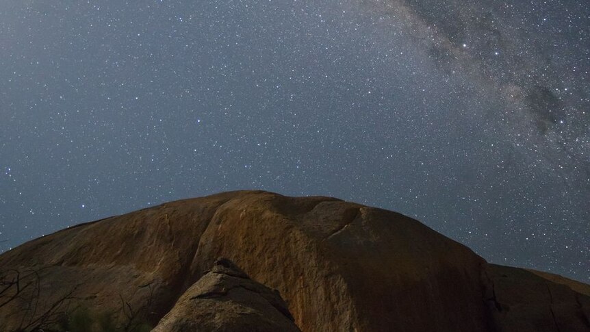 The Milky Way and the stars above a large rocky hill called Mount Hope in Central Victoria.