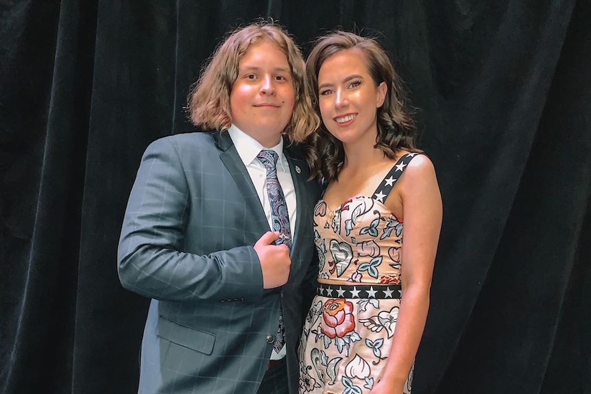 A young couple at a formal event.