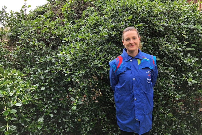 Rachel Delphin wearing the jacket she wore during her volunteering role at the Sydney Olympics