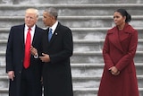 Michelle Obama looks stern while standing with Melania Trump, Donald Trump and Barack Obama