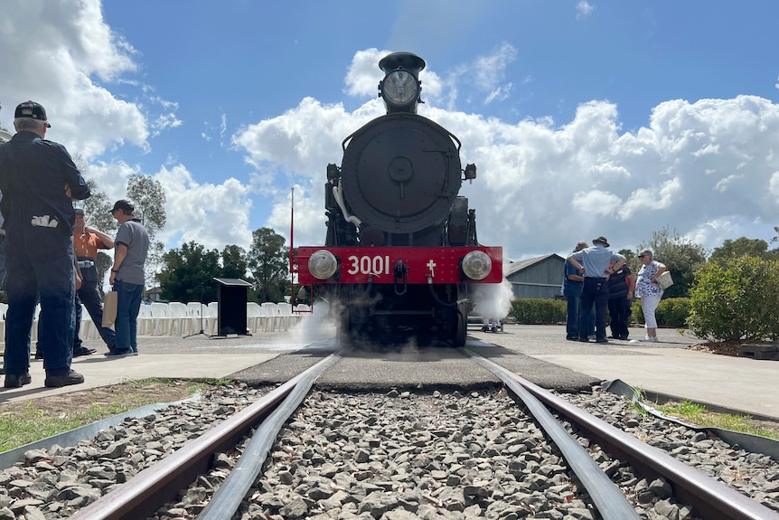 The front of a steam engine, as pictured from low down