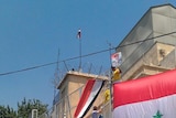Pro-government protesters gather outside the US embassy in Damascus