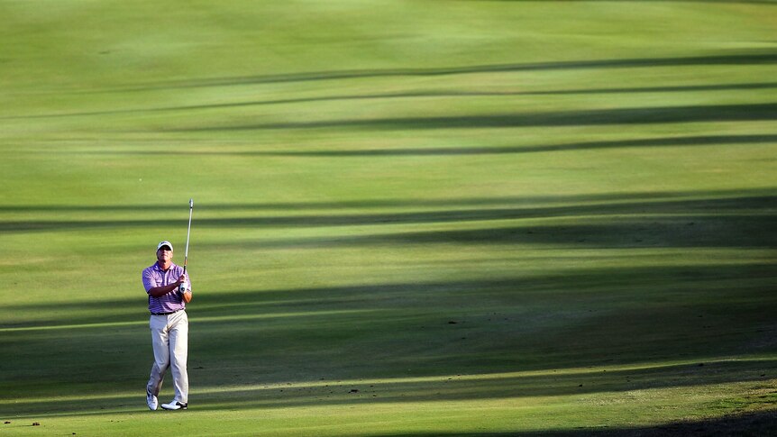 Still leading ... Steve Stricker plays a shot on the 18th hole (Sam Greenwood: Getty Images)