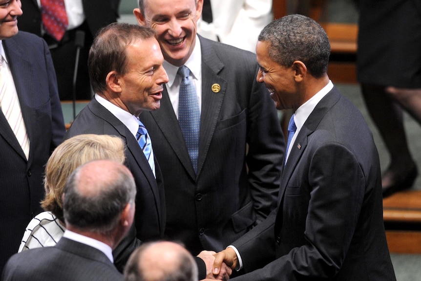 Tony Abbott greets Barack Obama in the House of Representatives chamber.