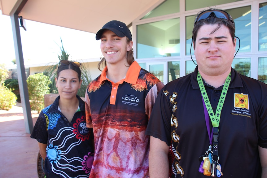  Alyne Fry-Croydon, Lachlan Dunemann and Jordan Gillard stand together at Papulu Aparr-kari