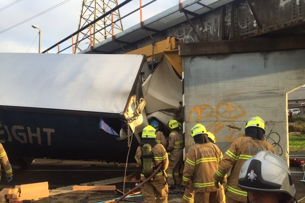 MFB fire fighters work to free a driver after a truck crash