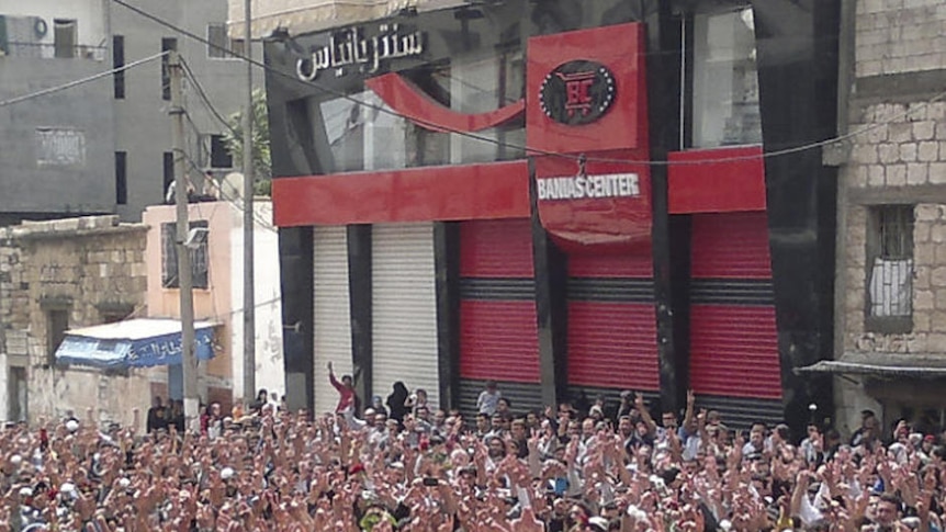 Syrian protesters gather during a demonstration in the port city of Banias