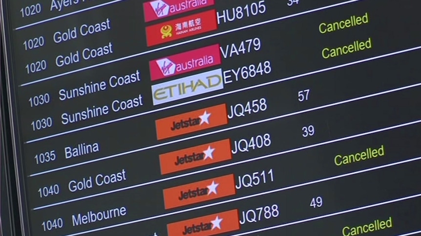 A display at airport showing cancelled flights