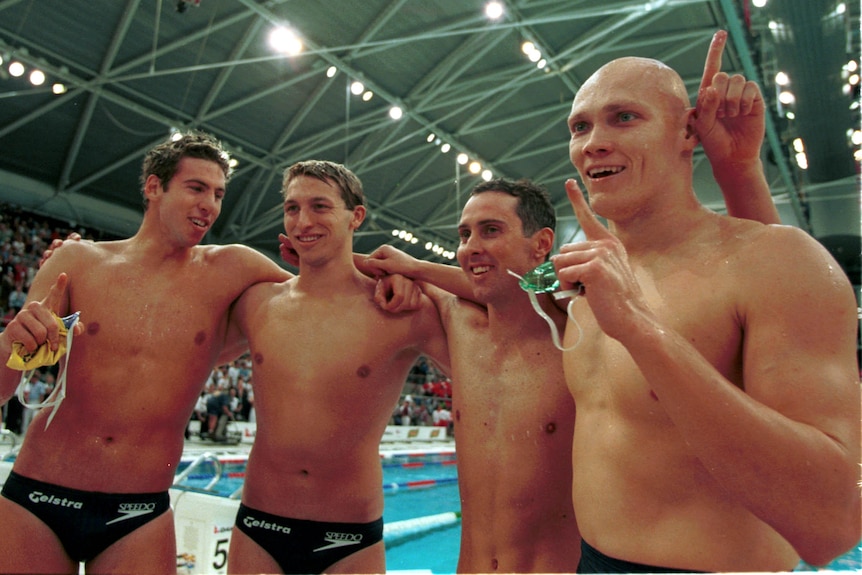 Ian Thorpe, Grant Hackett, Bill Kirby and Michael Klim celebrate.