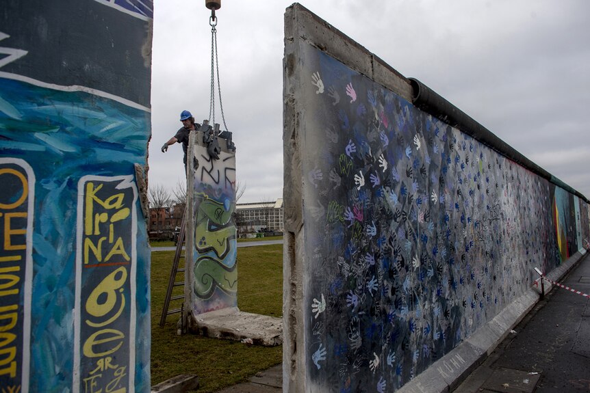 Builder removes section of Berlin Wall