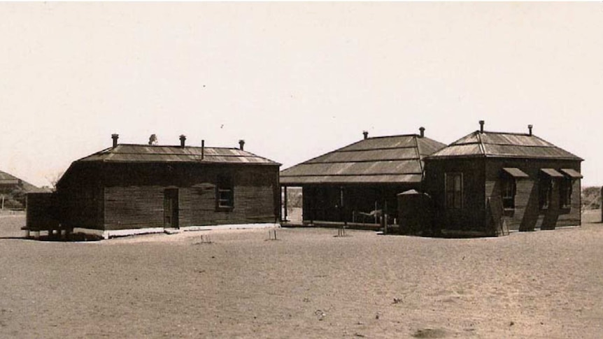 Sepia photos of three buildings surrounded by dirt