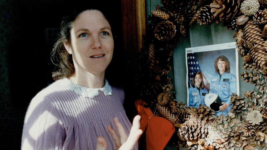 Christa McAuliffe's friend Ginny Timmons with a photo of the Challenger astronaut.