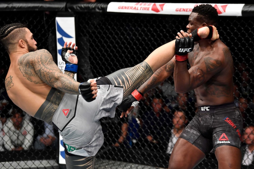Tyson Pedro fights in a UFC bout