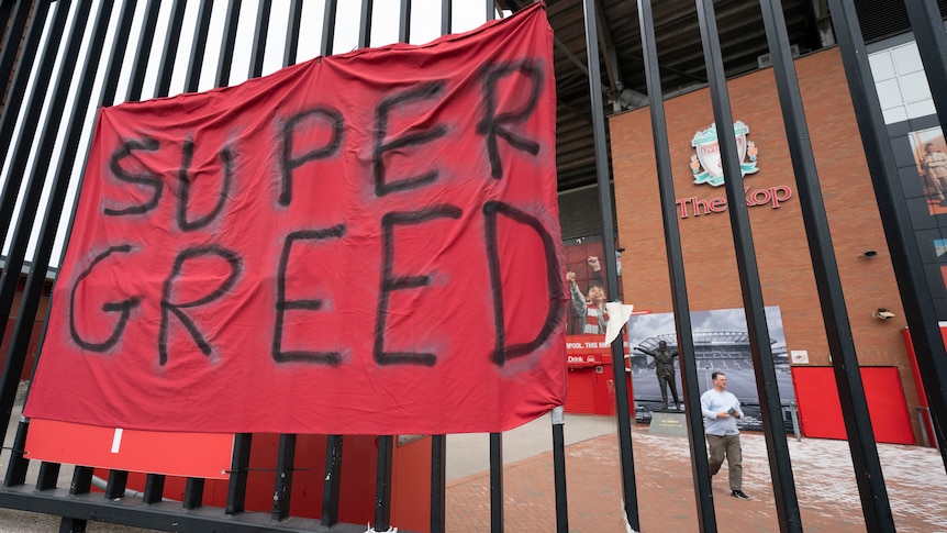 A protest banner against the proposed Super League is seen outside Liverpool's Anfield Stadium.