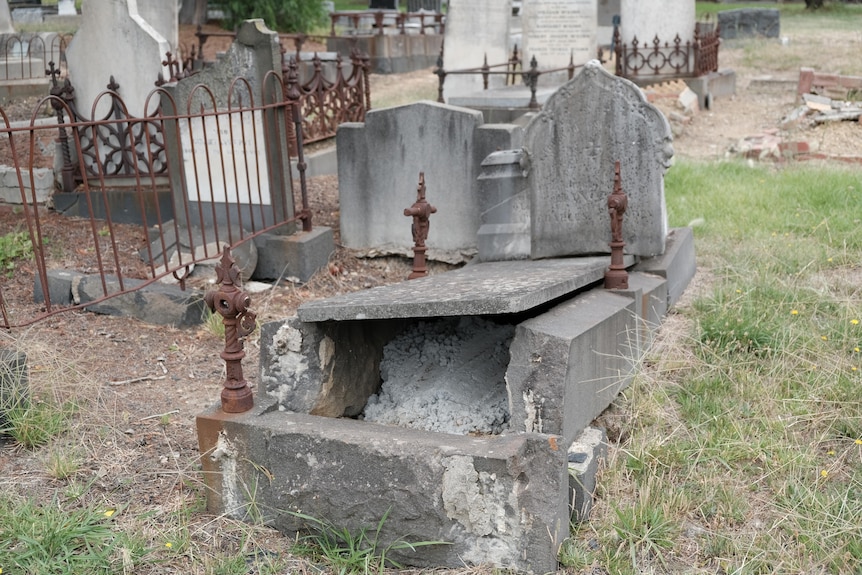 Damaged gravestones at a cemetery