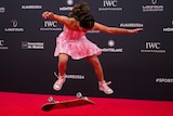 Arisa Trew photographed in mid-air above her skateboard while doing a trick on the red carpet at the Laureus sport awards.