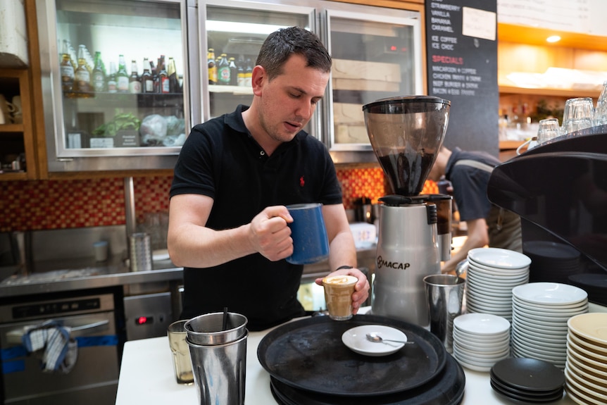 Chris Kriketos making a coffee