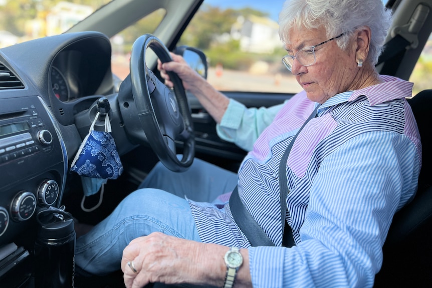 a woman driving in a car