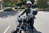 Woman wearing helmet on a motorbike. 
