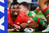Tevita Pangai Junior scores a try and sticks his tongue out in celebration