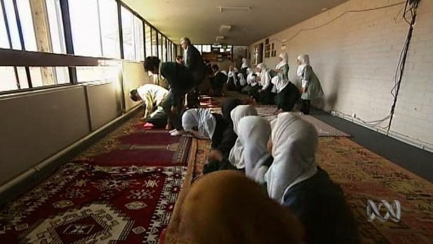 Muslims participate in prayer