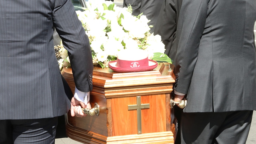 Pallbearers carry Vanessa Goodwin's casket from St David's Cathedral, Hobart.