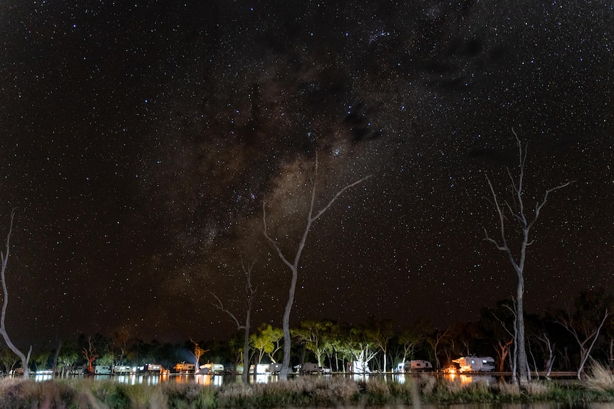 Campers set up along the waters edge at Lara Wetlands