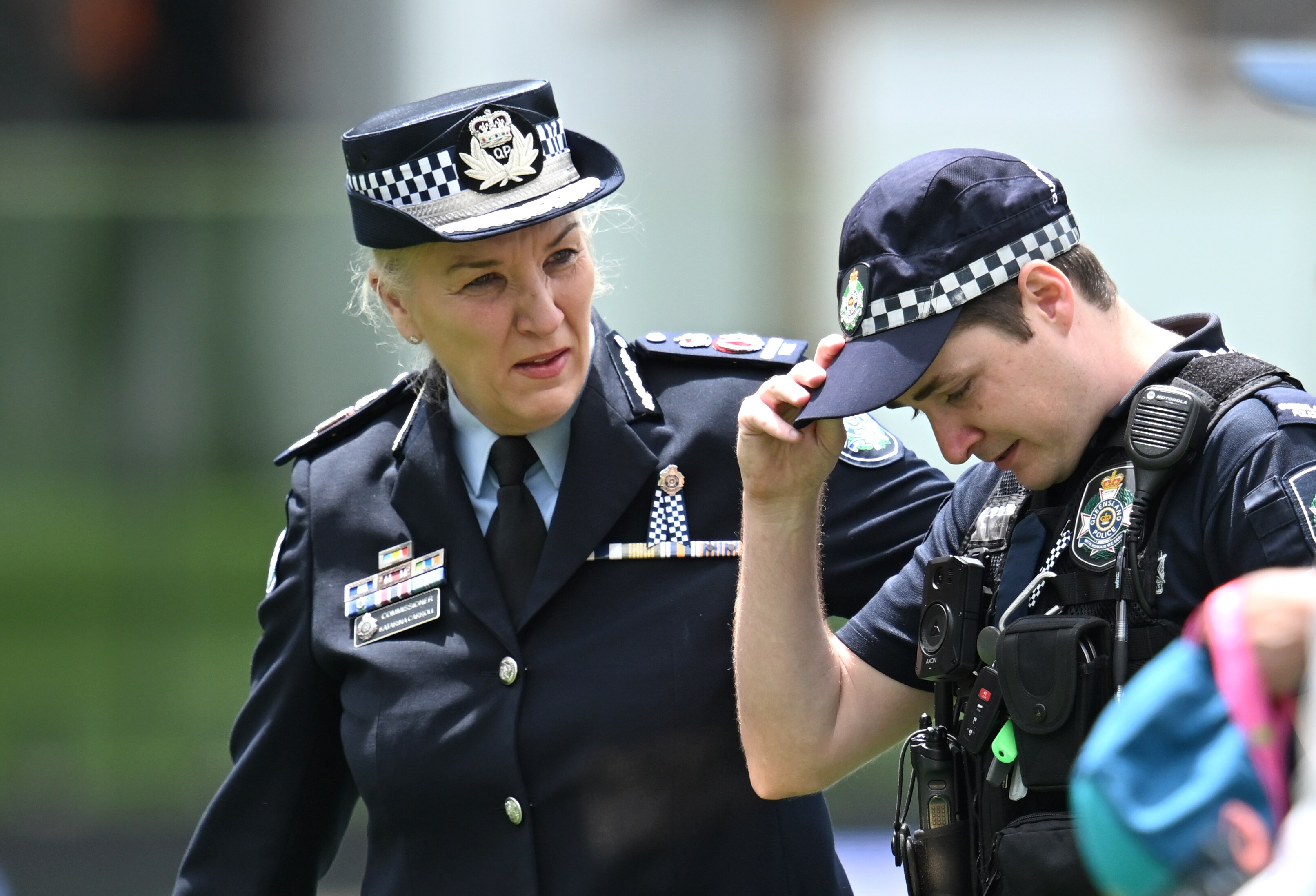 Katarina Carroll puts her arm on the shoulder of a young constable.