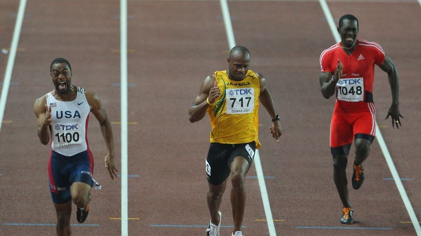 Upset ... Asafa Powell (c) finishes a distant third behind Tyson Gay (l)