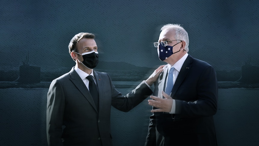 Emmanuel Macron puts his hand on Scott Morrison's shoulder.