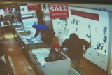 Three bandits brandishing smash through a jewellery store at Elsternwick