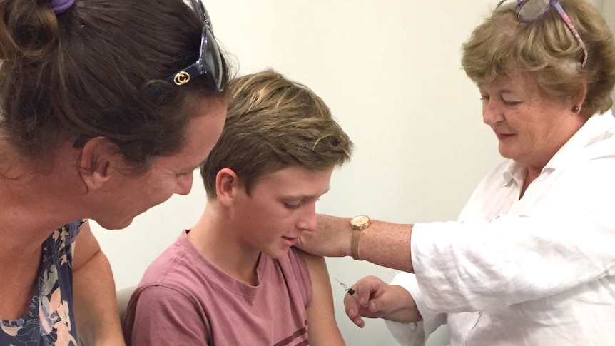 A boy receives a Q fever vaccination.
