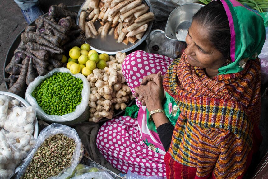 Woman vendor in spice market India