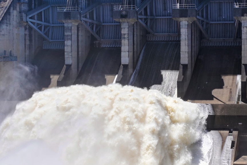 Water gushing through the gates of Wivenhoe Dam during a water release.
