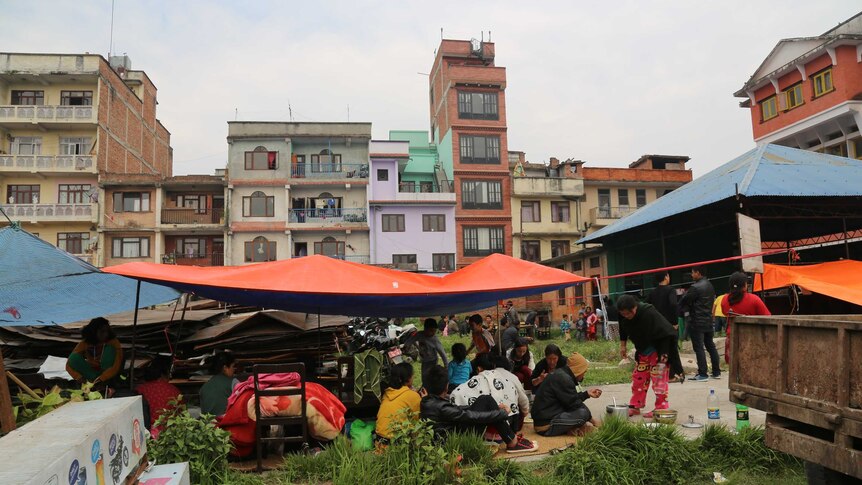 People evacuating into a public space in Nepal