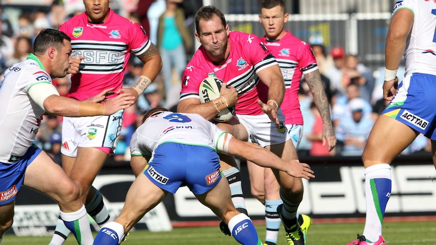Ben Ross attacks for the Sharks against the Raiders