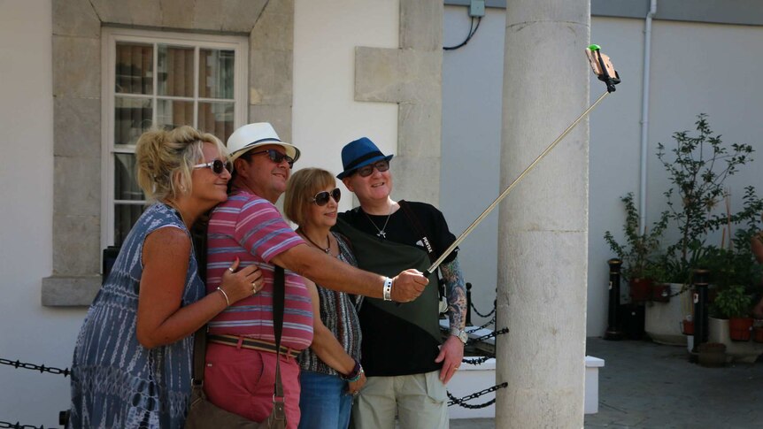 Tourists pose for a photo in Gibraltar