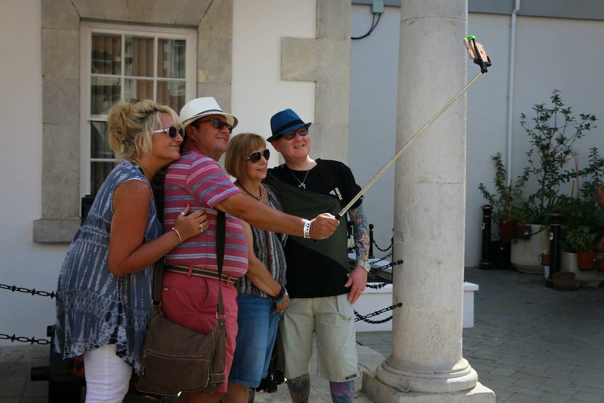 Tourists pose for a photo in Gibraltar