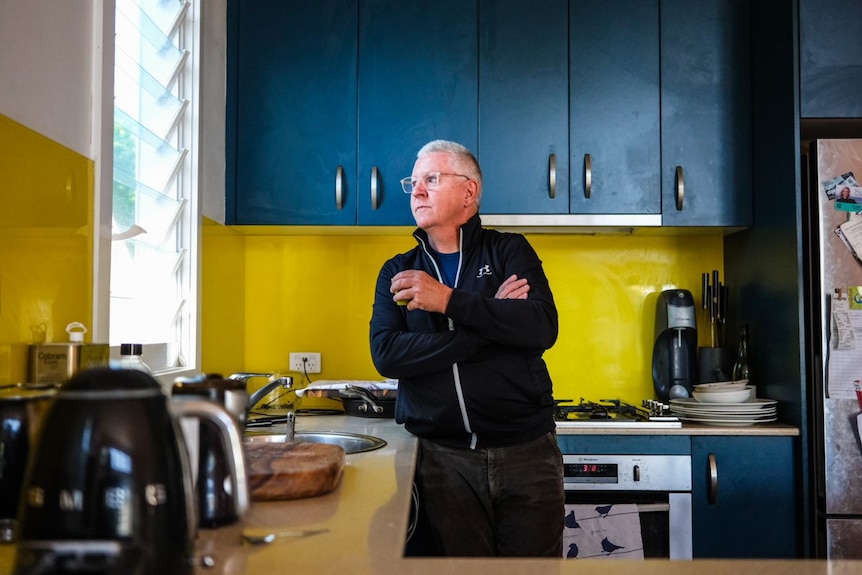 Paul Smith in kitchen looking outside