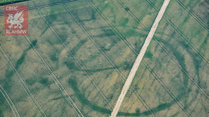 Cropmarks of a large prehistoric enclosure in the Vale of Glamorgan with the faint footings of a probable Roman villa within.