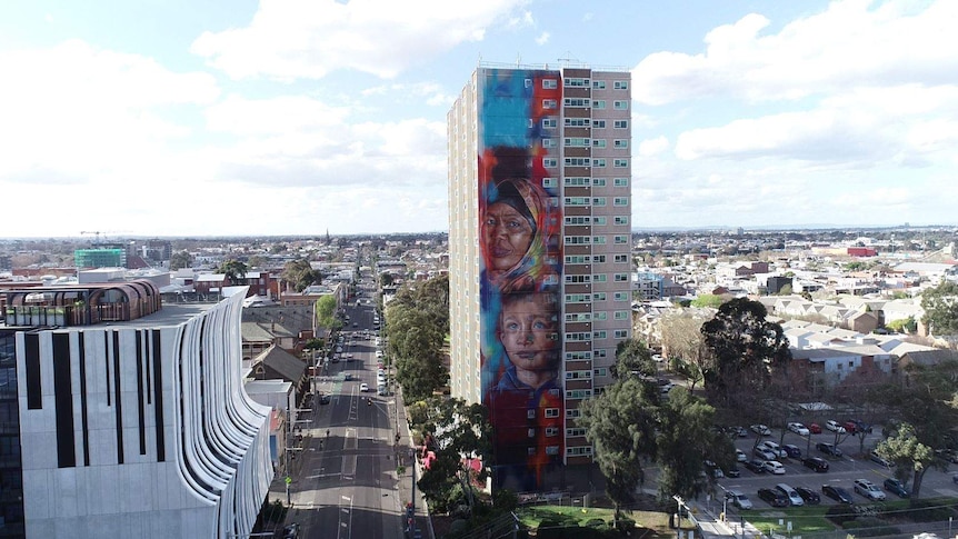 The 20-storey mural on the Collingwood public housing tower, looking down the street from the air.