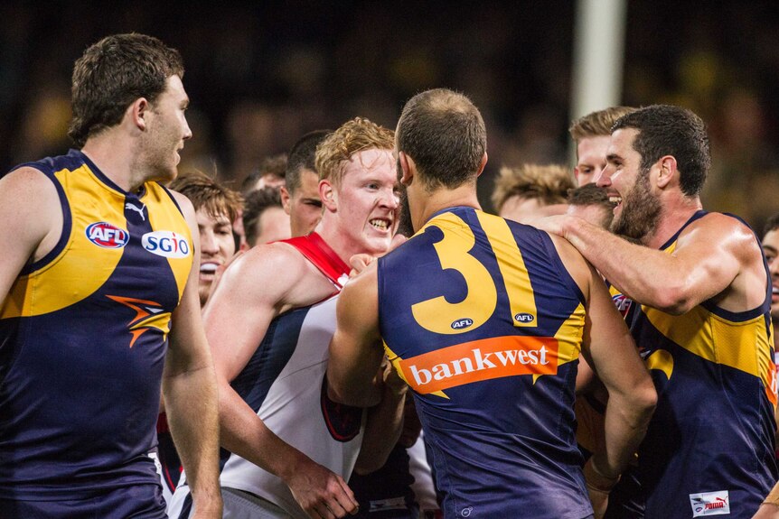 Melbourne Demons and West Coast Eagles players scuffle