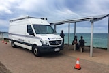 A police van at Glenelg Beach