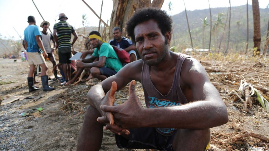 Sunia Tuwai sits in the ruins of Koro village.