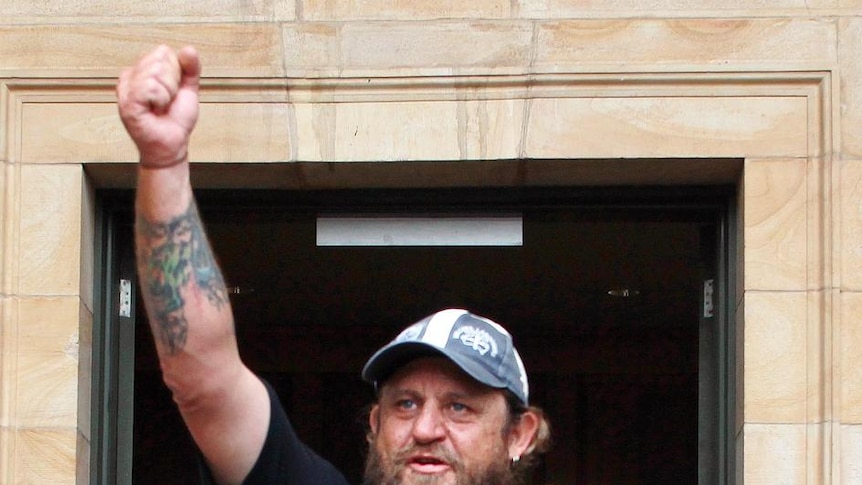 Unionist Ark Tribe celebrates outside Adelaide Magistrates Court