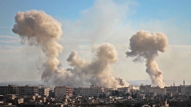 Plumes of smoke and dust as bombs pummel the city of Ghouta, near Damascus.