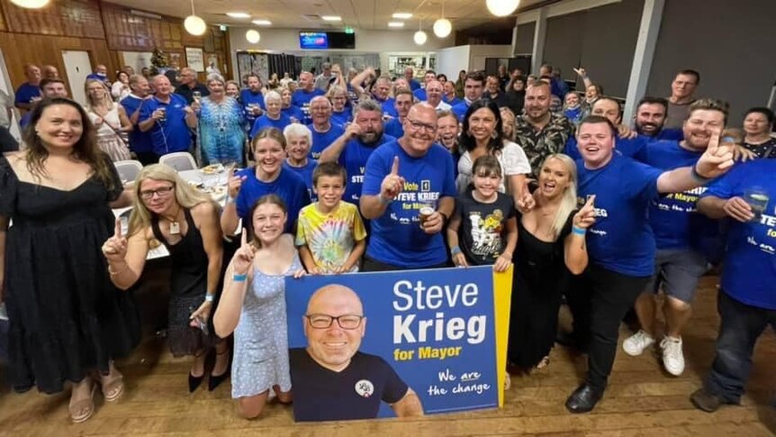 Steve Krieg celebrates, surrounded by supporters