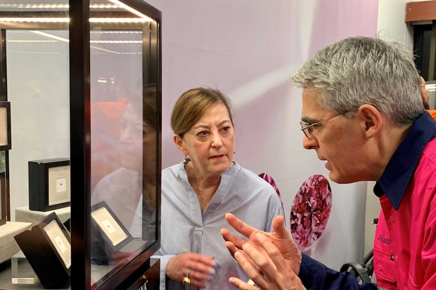 Jewellery historian Vivienne Becker and Rio Tinto copper and diamonds chief executive Arnaud Soirat look at diamonds in cabinet
